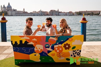 Three artists pose with their collaborative piece of urban art, a sofa celebrating Aperol’s centenary and role in sparking joyful co<em></em>nnections 